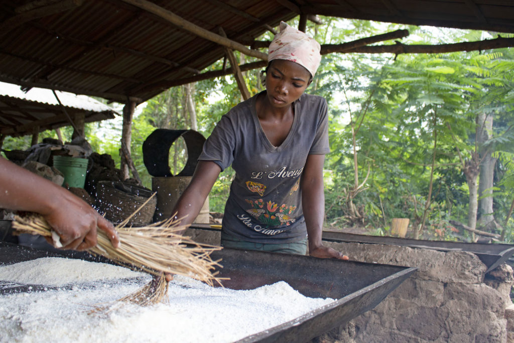 woman processing cassava