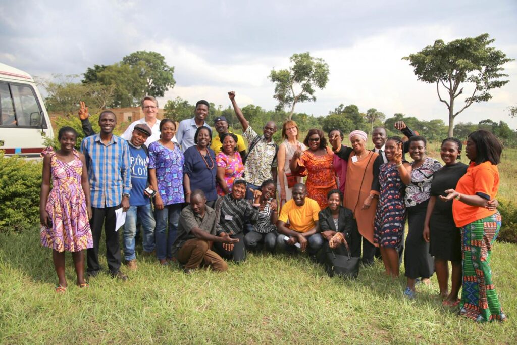 group of happy university students pose for a photo