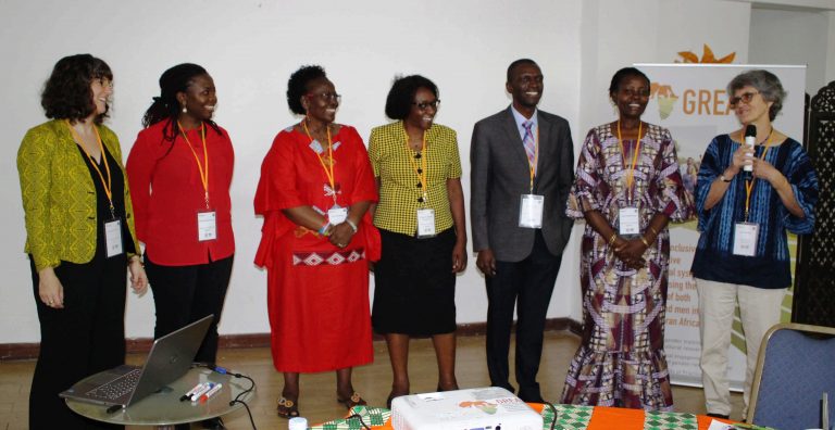 a group of trainers stand before participants