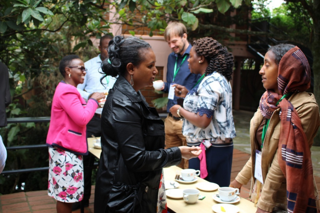 participants socialize during a break from the course