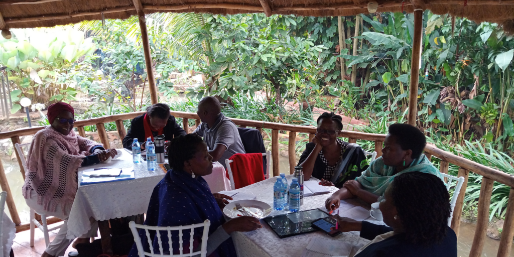 particpants have a discussion around a table